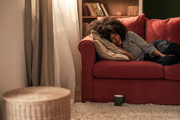 istock Tranquil black woman taking a nap on sofa at home. 2249273779