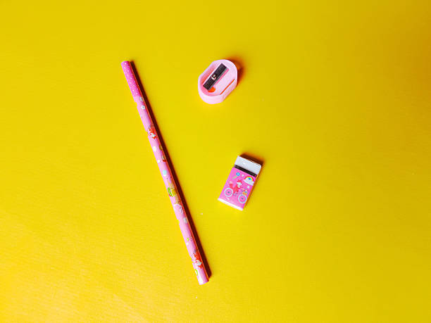 istock stationery set pencil sharpener, pencil eraser are on a yellow background 2249274715