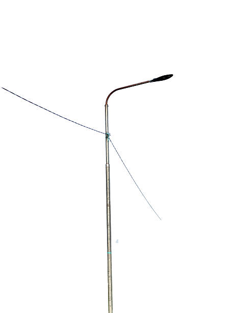 istock Simple street lamp post with a curved arm and supporting wires. Isolated on a clean white background for a minimalist look. 2249276984
