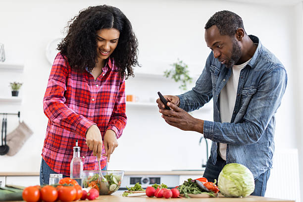 istock Couple Cooking and Taking Photo 2249277905