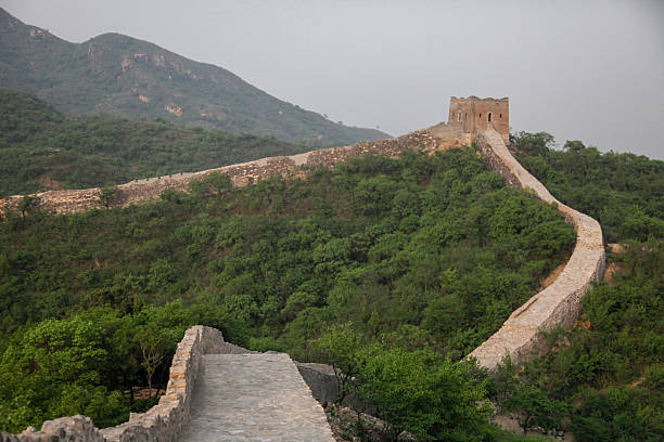 istock The Great Wall winding through lush green mountains 2249278236