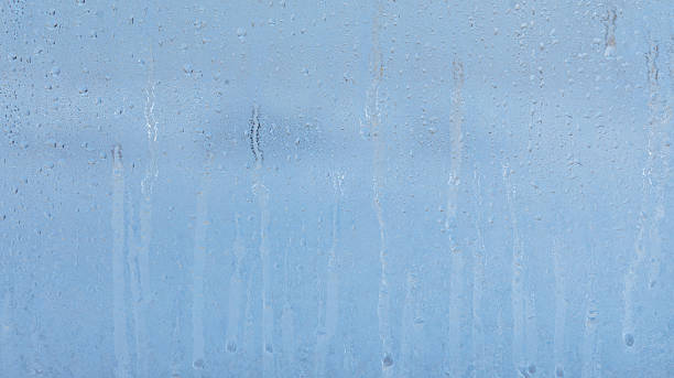 istock Frozen water drops on glass as an abstract background. 2249280527