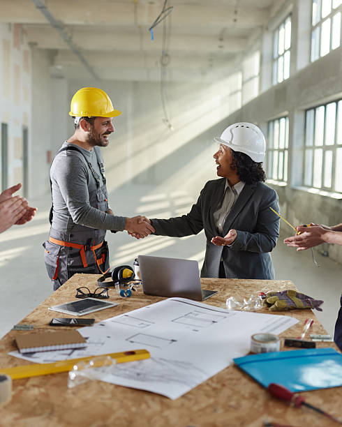 istock Successful deal between female architect and manual worker! 2249280771