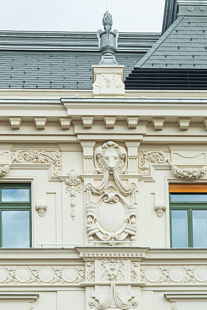 istock Architectural facade with lion carving and stone ornaments. 2249282225