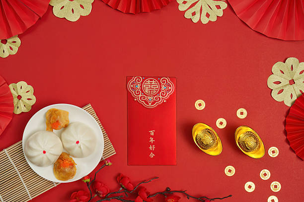 istock Chinese New Year Celebration with Dumplings and Red Envelopes 2249283207