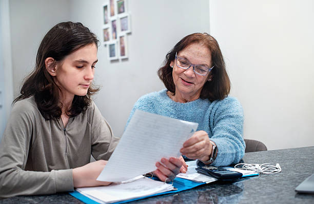 istock 67-year-old grandmother assists her teenage grandson with math problems. Educational support for a student with OCD. 2249283225