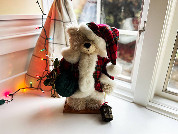 Toy snowman in on xmas tree with decorations Christmas Merry Mhristmas.