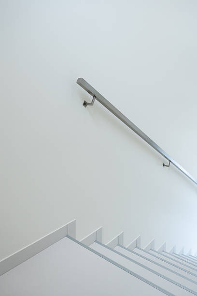 istock Minimalist White Staircase With Metal Handrail In Bright Interior For Modern Architecture Use 2249287265
