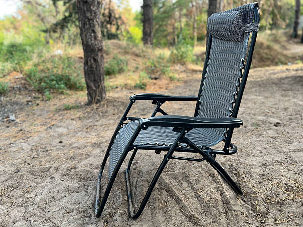 istock Portable recliner chair standing on sand in forest 2249288200