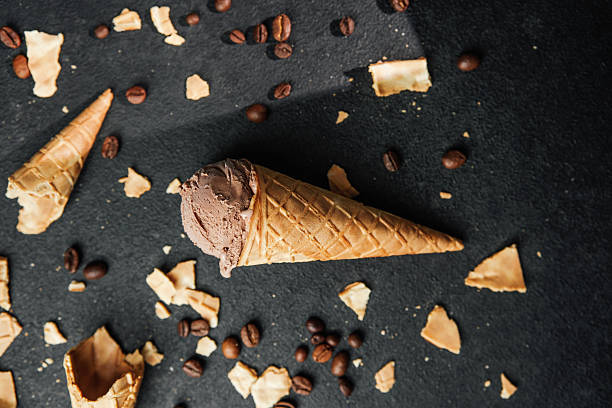 istock Chocolate ice cream cone with coffee beans and waffle crumbs on dark background 2249288268