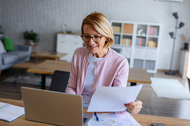 istock Woman Analyzing Home Budget on Laptop 2249288498