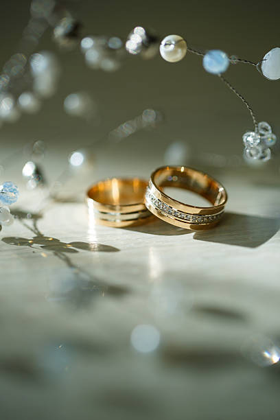 istock Gold wedding rings for newlyweds on wedding day 2249290641