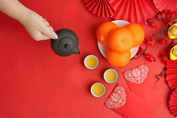istock Tea ceremony with oranges and red envelopes for Lunar New Year 2249290804