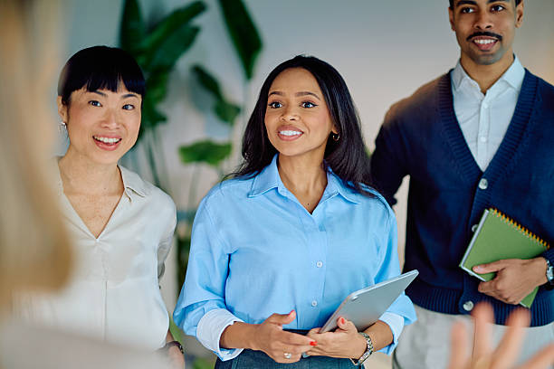 istock Diverse business team listening actively during a professional office meeting, collaborating with colleagues 2249292045