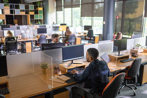 istock Diverse Business Executives Engaged in Tasks at Modern Open Plan Office 2249295919