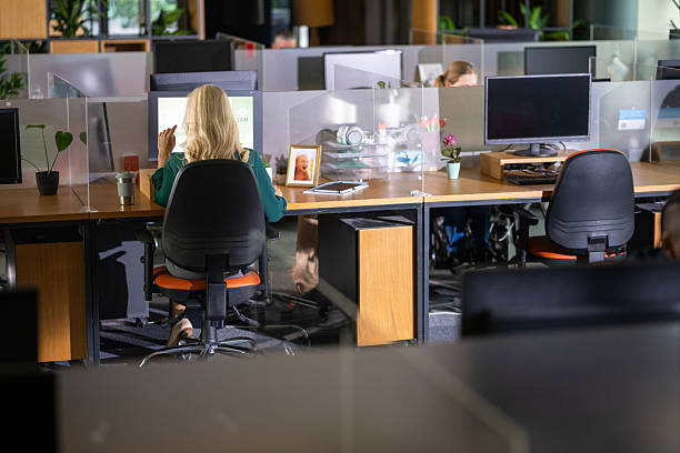istock Caucasian Woman Engaged in Productive Work at Modern Office Desk 2249296021