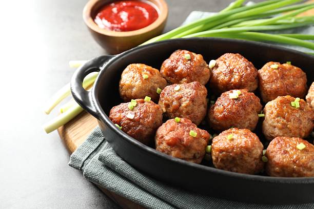 istock Tasty meatballs served on grey table, closeup 2249296779