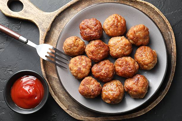 istock Tasty meatballs served on grey table, flat lay 2249296800