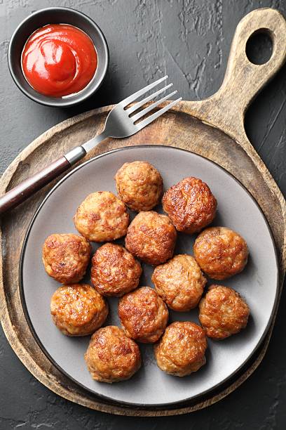 istock Tasty meatballs served on grey table, flat lay 2249296835