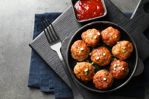 istock Tasty meatballs served on grey table, flat lay 2249296880
