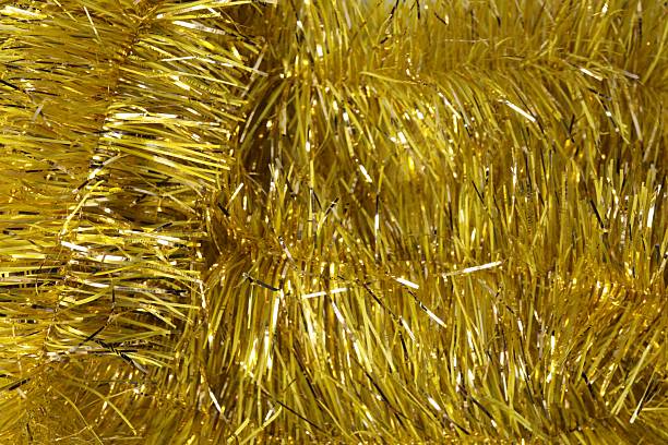 istock Shiny yellow tinsel as background, closeup view 2249300215