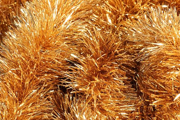 istock Shiny golden tinsel as background, closeup view 2249300250