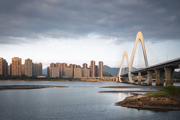 istock Modern Bridge and Building Complex by the River in the City 2249301193