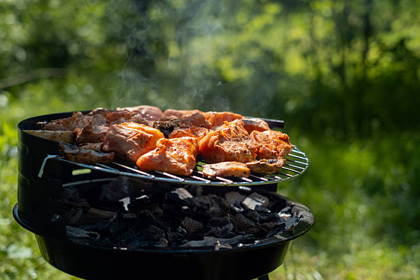 istock Delicious dinner outdoors steaks slowly grilling on the barbecue for a perfect evening meal. 2249301880