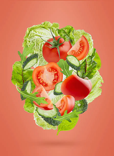 istock Healthy fresh vegetables as flying composition. Organic vegetable salad ingredients - tomatoes, green cucumbers, mixed greens, chinese cabbage on red background. Vegetarian diet food for detox eating. 2249302127