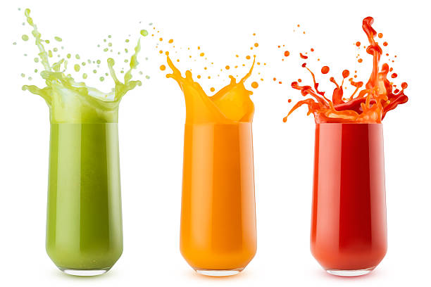 istock Bright vegetable juices different colors with dynamic splashes, flying drops in glasses, isolated on white background. Carrot juice, tomato juice, spinach juice. Assortment of three glasses. 2249302213