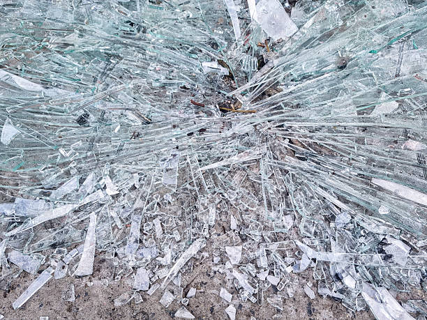 Pattern of cracked tempered glass caused by an impact, accident / vandalism damage - backgrounds.