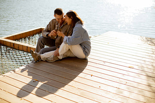 istock Loving moments by the serene lake during a sunny afternoon 2249302437