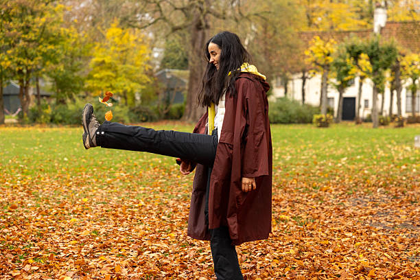 woman posing in forest during fall season