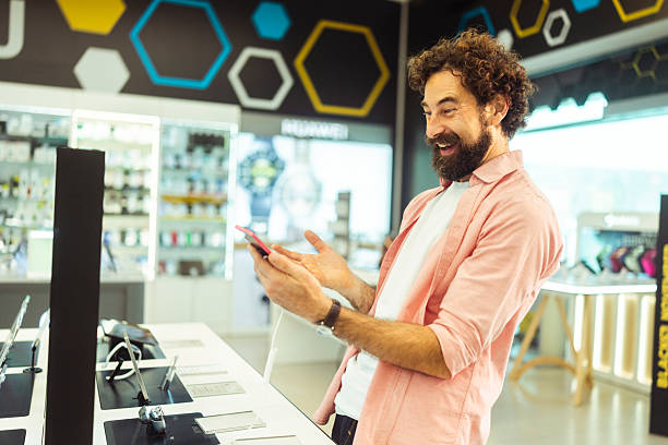 istock Side view of a Smiling Male Customer Checking Smartphone Before Black Friday Purchase 2249303257