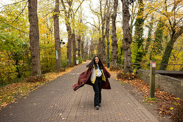 woman posing in forest during fall season
