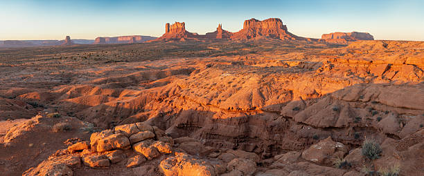 istock Dramatic view of the Monument Valley's magnificent butte and mittens lit up during a sunset.Iconic butte, spire and mitten formations used as a backdrop in many old western movies. Navajo,Arizona. 2249303577