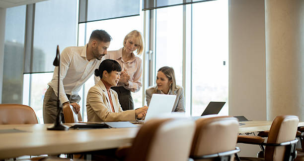 istock Team members collaborating in a modern office space during a business meeting 2249303637