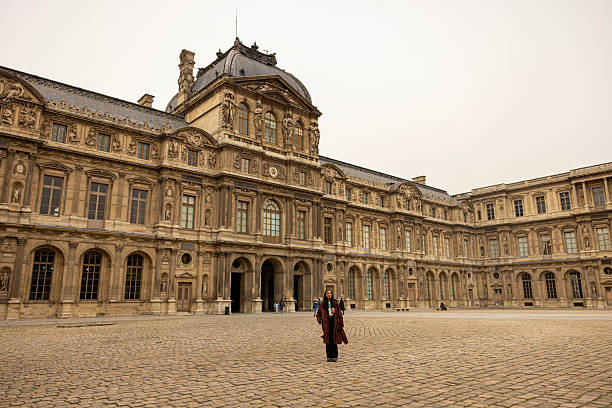 Woman posing in front of historical building