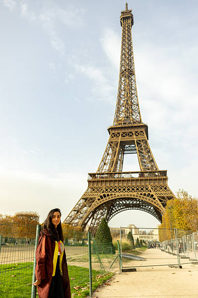 istock woman posing in front of Eiffel Tower 2249304106