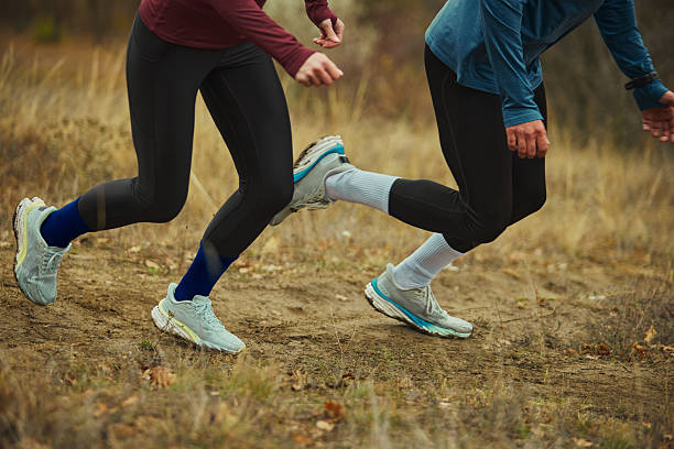 istock Close-up of runners legs on forest trail showing dynamic stride and power 2249305814
