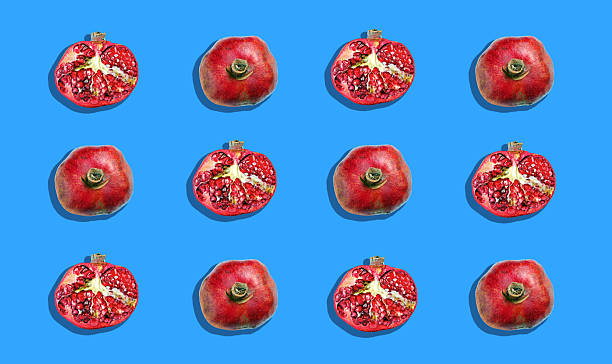 colorful pattern of pomegranates on a blue background. fruit pattern.