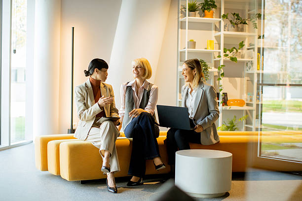 istock Business colleagues discussing ideas in a modern office setting during the day 2249308190