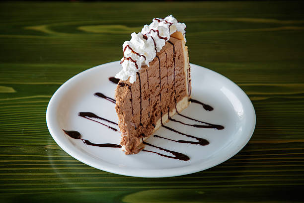 istock Slice of layered cake with whipped cream in a plate 2249308418
