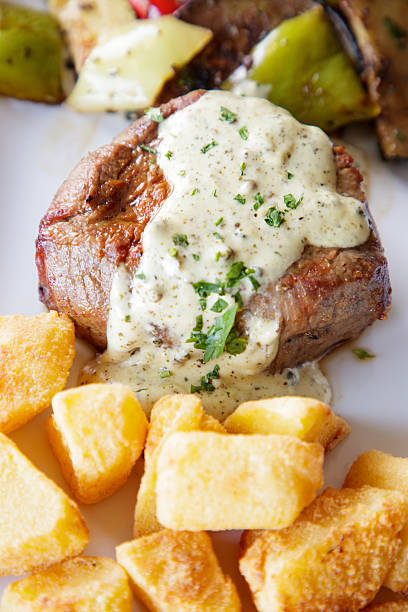 istock Meat chop served with baked potato and grilled zucchini 2249308636