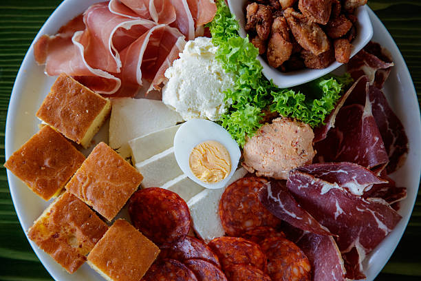 istock Close-up on appetizer plate on restaurant table, delicatessen and corn bread 2249308761
