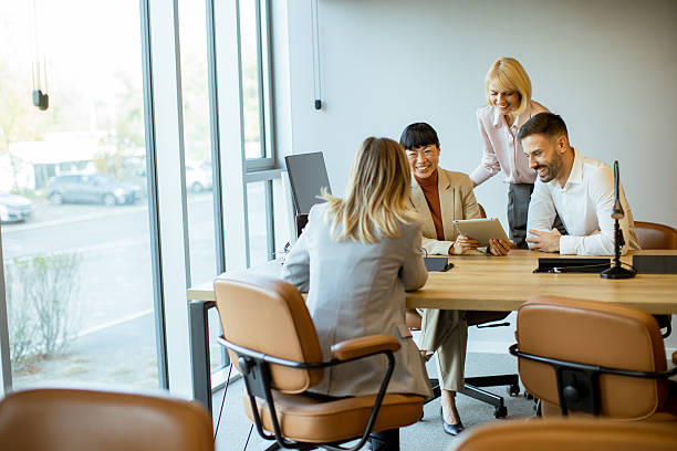 istock Business team reviewing data in office setting during daytime meeting 2249308800