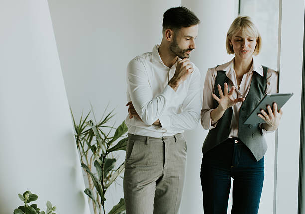istock Business professionals discussing plans in modern office 2249308807