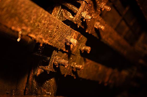 istock Wet, heavily rusted metal bolts and structural supports inside a dark, old coal mine 2249311109