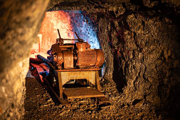 istock Historic, rusty double-drum winch (scraper) in a dark coal mine tunnel 2249311141