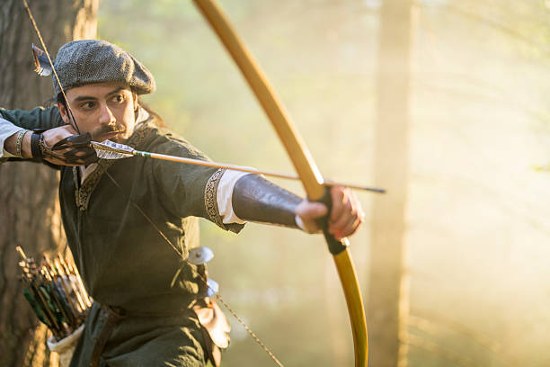 A young Caucasian male archer in a sunlit forest, drawing his bow with focused determination as sunlight filters through the trees, creating a serene atmosphere.